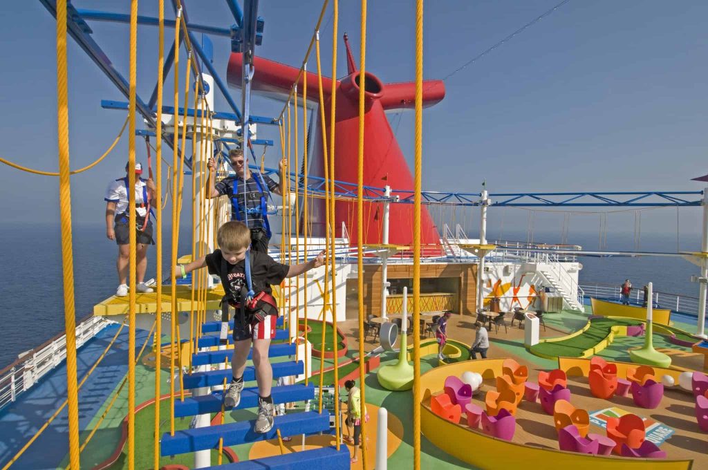 Guests on board the new Carnival Magic try out SkyCourse, the first-ever ropes course at sea in which participants can traverse suspended cables with views 150 feet to the sea below. The course is part of an expansive outdoor recreation area on the ship called SportSquare.