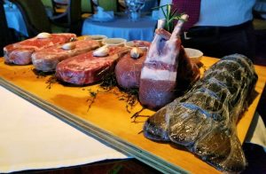 A display for the steaks and seafood available.