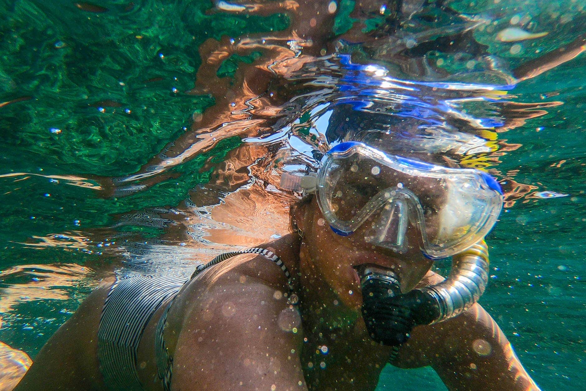 woman wearing goggles and snorkel